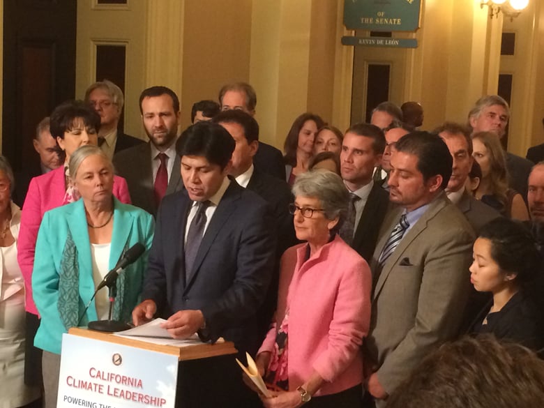 Senate President pro Tem Kevin de León (D-Los Angeles) celebrates his chamber's passage of legislation that would implement Gov. Jerry Brown's greenhouse gas reduction goals Wednesday at the state Capitol in Sacramento.
