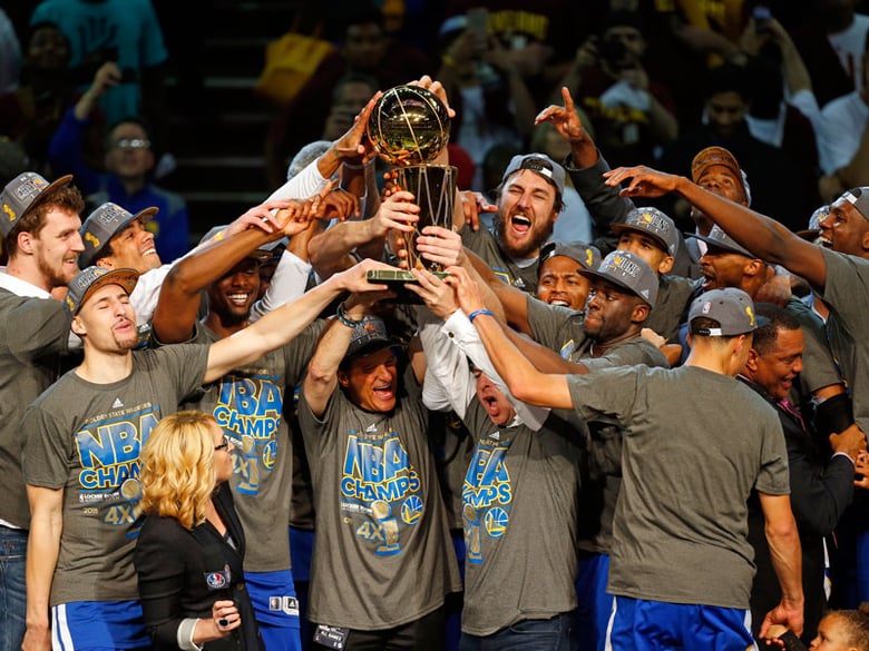 The members of the Golden State Warriors celebrate after winning the NBA Finals against the Cleveland Cavaliers in Cleveland, Wednesday, June 17, 2015. The Warriors defeated the Cavaliers 105-97 to win the best-of-seven game series 4-2.