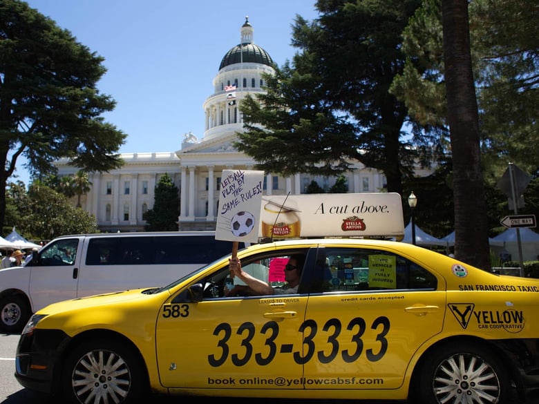 A taxi driver protests ride-sharing companies in this 2014 photo in front of the state Capitol.