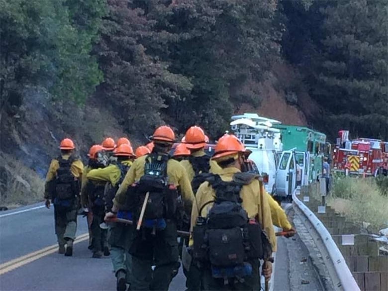 Crews head into the Kyburz Fire area along U.S. Highway 50. 