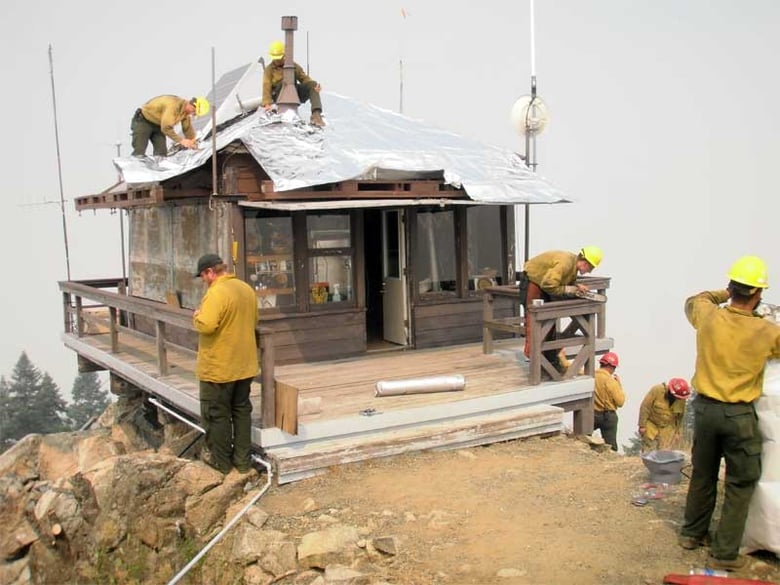Ironside Mountain Lookout being wrapped as part of the firefighting efforts during the River Complex Fire, August 2015. Photo posted to Inciweb.gov site on Aug. 10, 2015.