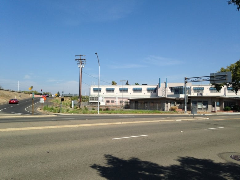 Fencing around an empty building is currently at the northwest corner of the proposed five-acre development on Stockton Boulevard between T and the U.S. 50 eastbound onramp.