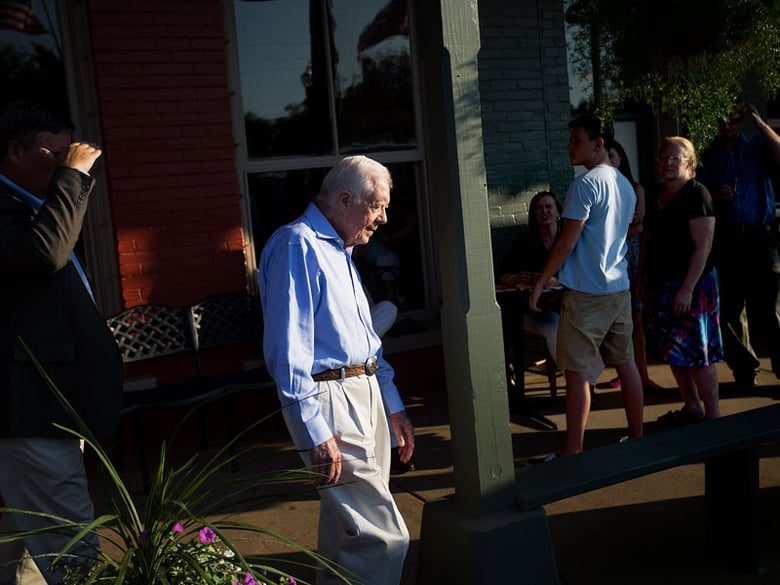 Former President Jimmy Carter leaves a reception in his hometown, Saturday, Aug. 22, 2015, in Plains, Ga. 