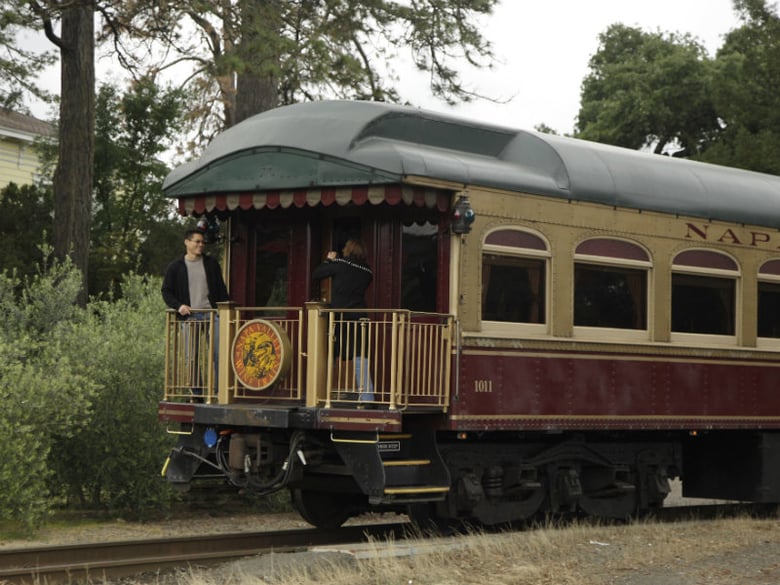 FILE: In this photo taken Thursday, June 2, 2011, a couple takes pictures at the back of the Napa Valley Wine Train as it makes its way through St. Helena, Calif. 