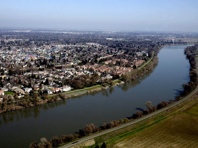 FILE - In this Feb. 22, 2006 file photo, houses located in the Pocket Area of Sacramento, Calif., are seen along the Sacramento River.