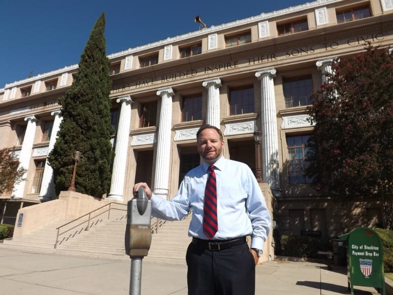 Micah Runner poses outside Stockton City Hall.