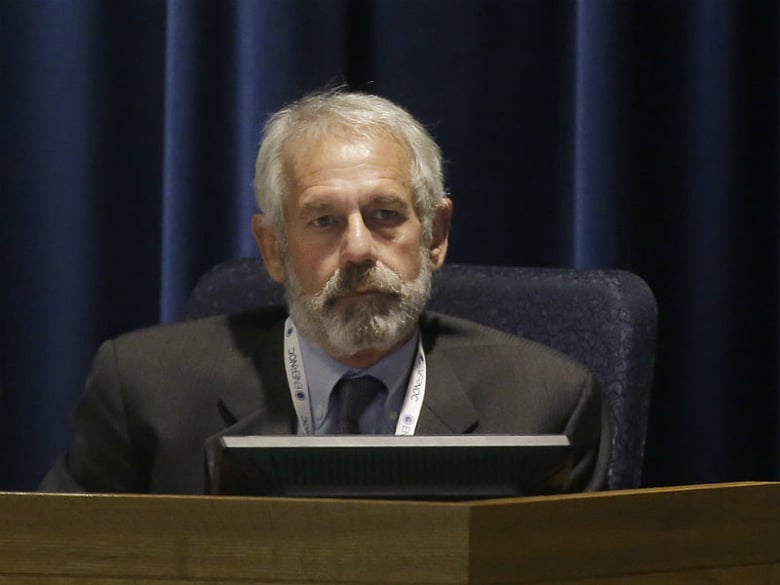 California Public Utilities Commissioner Michael Picker listens to speakers during a meeting of the five-member commission in San Francisco, Thursday, Dec. 18, 2014. (AP Photo/Jeff Chiu)

