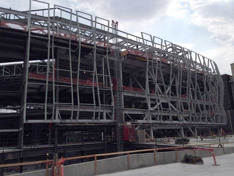 Installation of the wavy decorative features are underway at the downtown arena. Rooftop solar is expected to be installed beginning this winter.