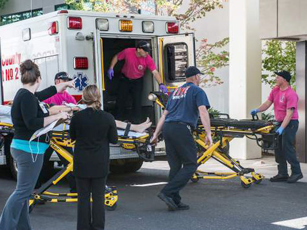 A patient is wheeled into the emergency room at Mercy Medical Center in Roseburg, Ore., following a deadly shooting at Umpqua Community College, in Roseburg, on Thursday. 