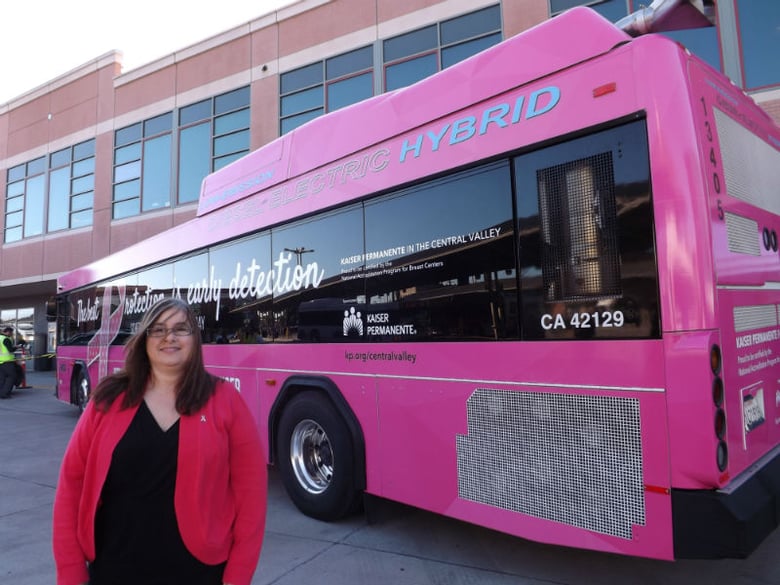 San Joaquin RTD unveiled a pink bus in honor of breast cancer awareness month. Cancer survivor Mary Ann King, poses in front of the bus.