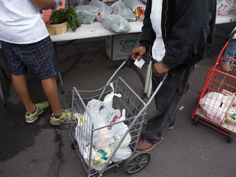 Staff at Sacramento Food Bank & Family Services help clients in north Sacramento. 
