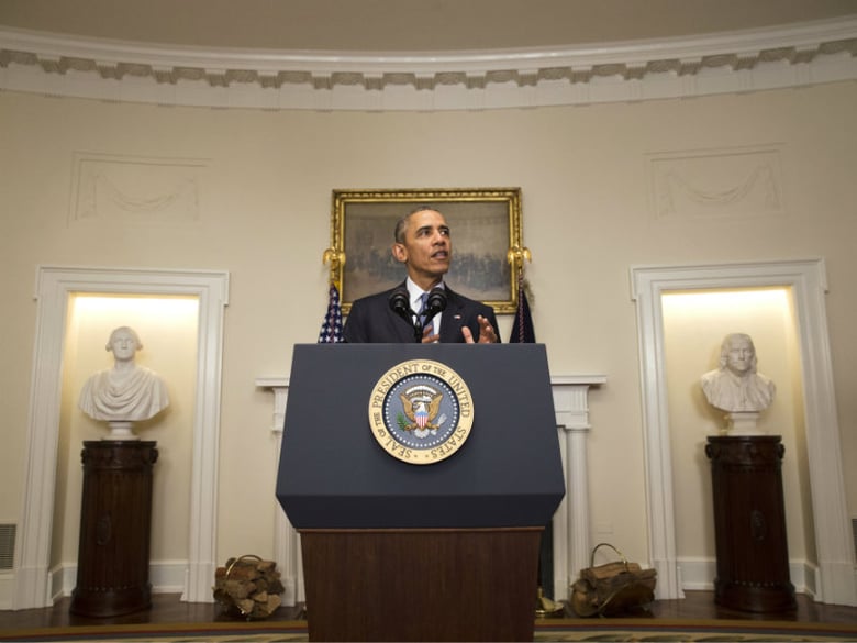 President Barack Obama speaks about the Paris climate agreement from the Cabinet Room of the White House in Washington, Saturday, Dec. 12, 2015. 