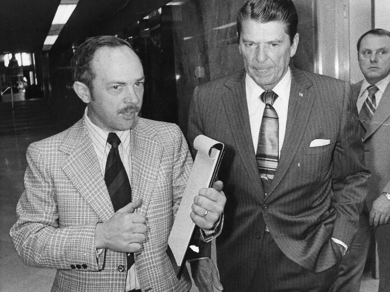 In this photo taken in 1974, Associated Press Correspondent Doug Willis, left, talks with then Gov. Ronald Reagan at the Capitol in Sacramento, Calif. 