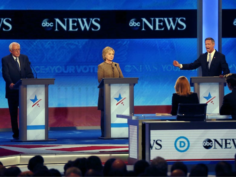 Martin O’Malley, right, speaks alongside Bernie Sanders, left, and Hillary Clinton, center, during a Democratic presidential primary debate Saturday, Dec. 19, 2015, at Saint Anselm College in Manchester, N.H.