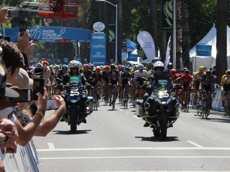 Motorcycles lead the riders out of the starting gate at the 2015 Amgen Tour Of California stage in Sacramento, CA.
