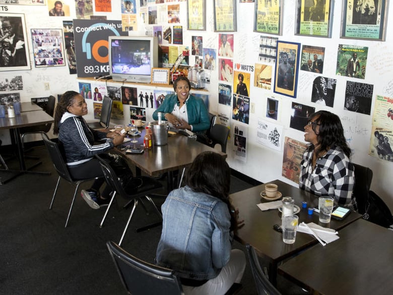 Top left to bottom right: BaVette Anderson, Henrietta Johnson, Lesley Cunningham and Mar'Kiesha Washington settle in for breakfast at the Watts Coffee House in Los Angeles on February 2, 2016.