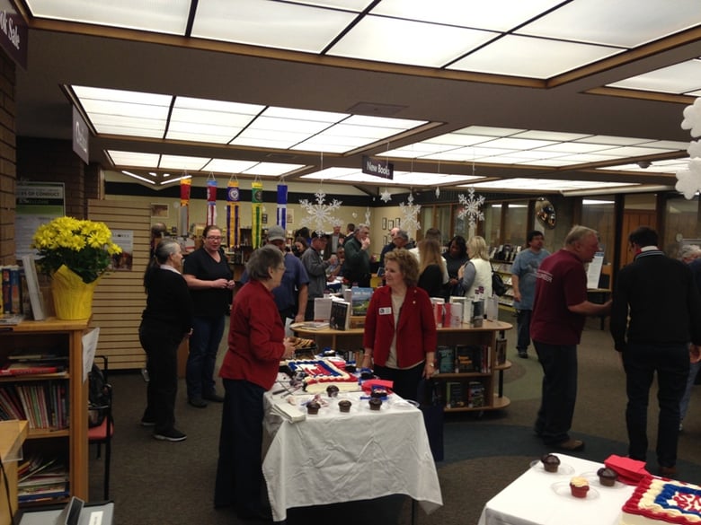 Veterans, volunteers, library staff and community members celebrate the opening of the new Veterans Resource Station at the Sacramento Public Library branch in Rancho Cordova. 