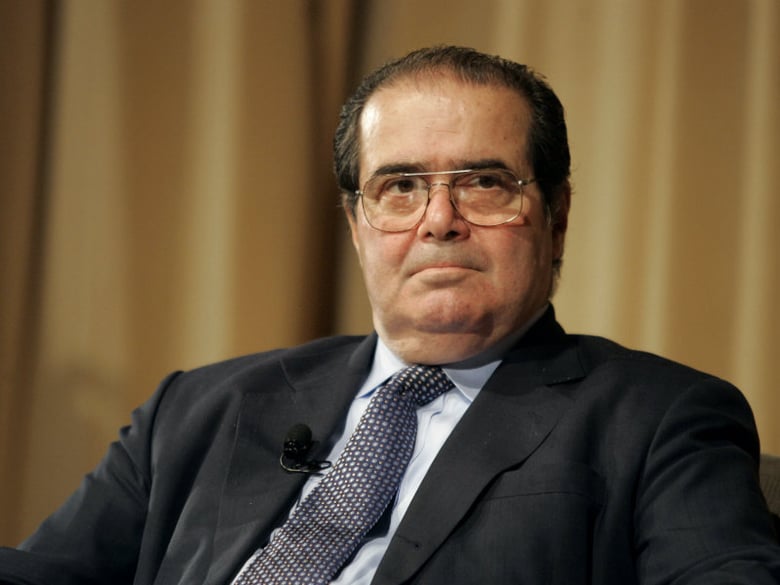Supreme Court Justice Antonin Scalia pauses during a "constitutional conversation" with fellow justices Sandra Day O'Connor and Stephen Breyer at the National Archives on Thursday, April 21, 2005 in Washington. 