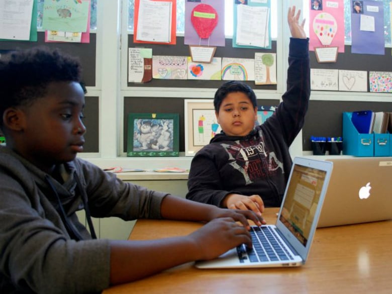 Eleven-year-old Carlos Delrio participates in a group discussion in his sixth grade classroom at Oak Ridge Elementary. 