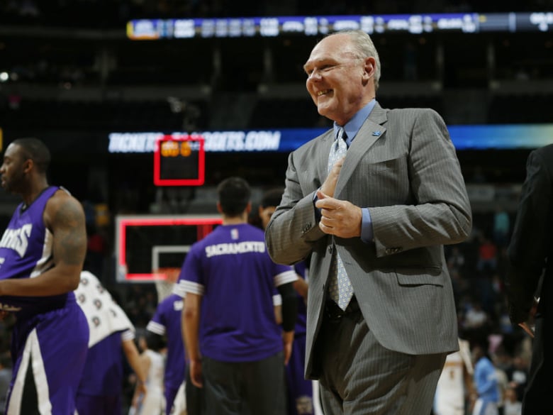 Sacramento Kings coach George Karl smiles as he walks off the court after the Kings defeated the Denver Nuggets 115-106 in the second half of an NBA basketball game Saturday, April 2, 2016, in Denver. 