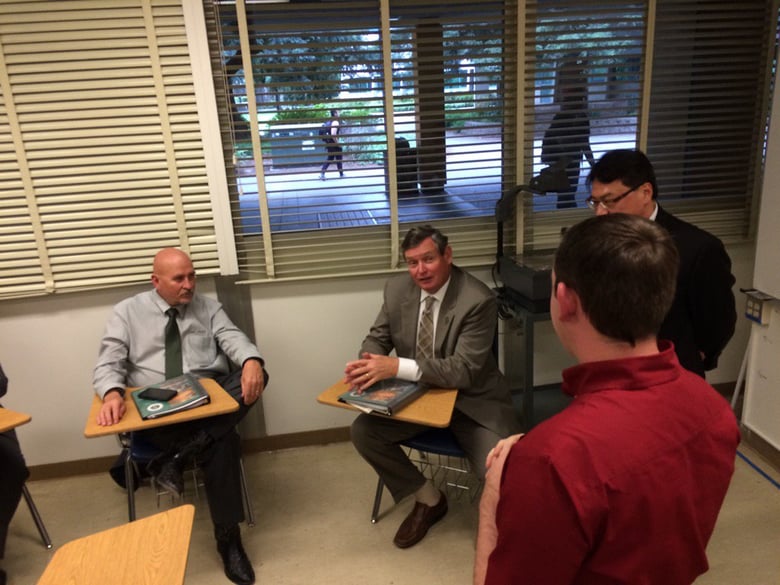 CSUS President Robert Nelsen, CSU Chancellor Tim White, and Provost Mike Lee ask questions of student Nathan Layne in Sequoia Hall. 