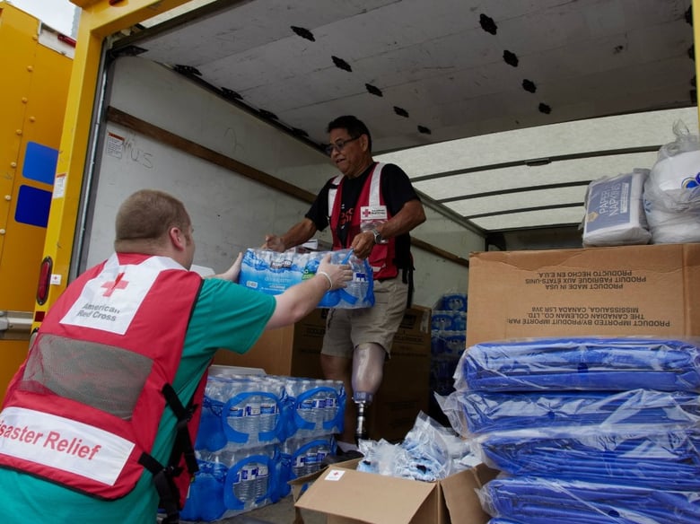 Red Cross volunteers distributing bottled water in the Houston area. 