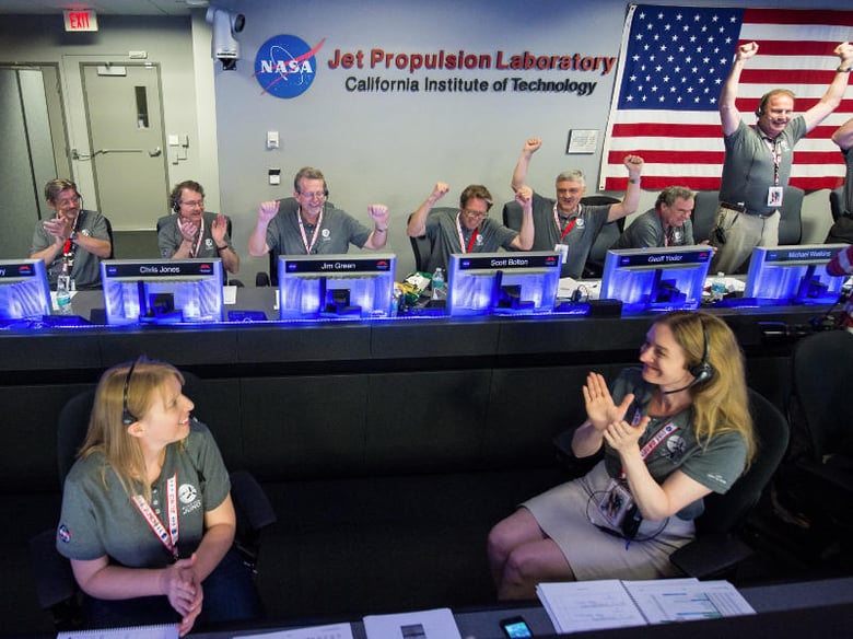 The Juno team celebrates after receiving confirmation from the spacecraft that it had successfully completed the engine burn and entered orbit of Jupiter, Monday, July 4, 2016.