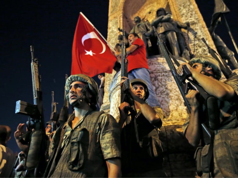 Turkish soldiers secure the area as supporters of Turkey's President Recep Tayyip Erdogan protest in Istanbul's Taksim square, early Saturday, July 16, 2016. 