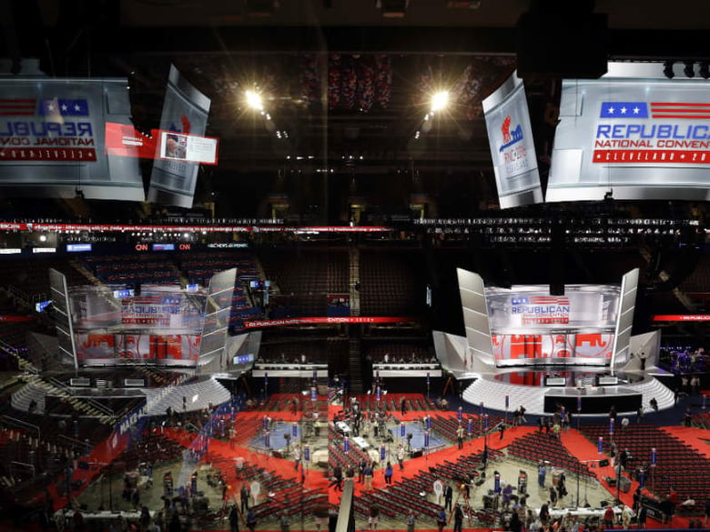 Workers place a sign as they prepare at Quicken Loans Arena for the Republican National Convention, Sunday, July 17, 2016, in Cleveland. 