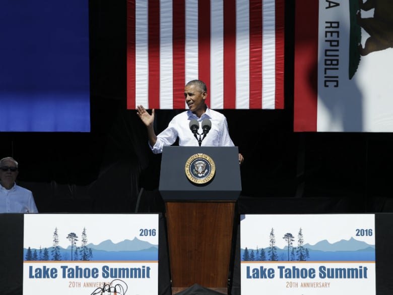 President Barack Obama, right, speaks with Senate Minority Leader Harry Reid of Nev., left, at the 20th Anniversary Lake Tahoe Summit, Wednesday, Aug. 31, 2016, in Stateline, Nev. Obama spoke about the environment and climate change. 