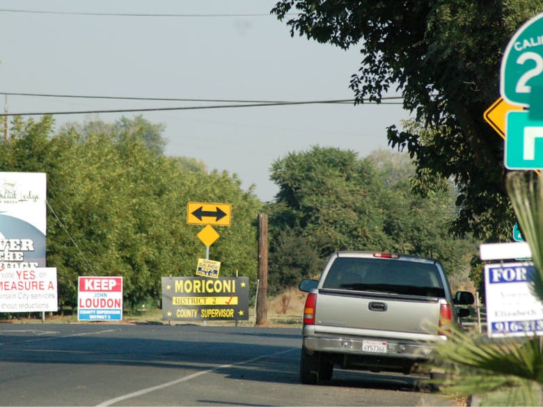 Signs within the public right of way or within 660 feet of a landscaped freeway are not allowed under state rules.
