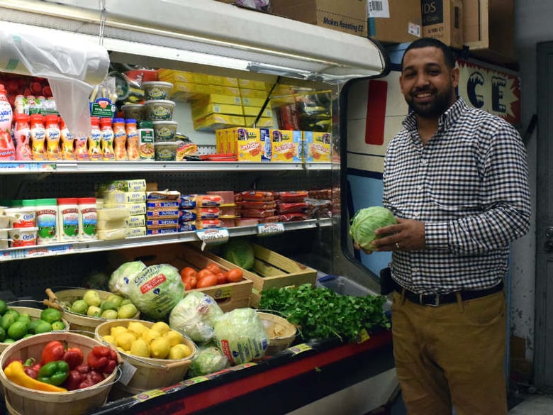 Ali Aldafari of Red Sea Market in Stockton with fresh produce at his store.