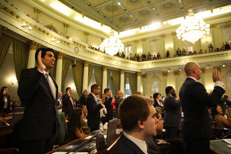 California state Assembly members take the oath of office at the Capitol on Monday, December 5, 2016.
