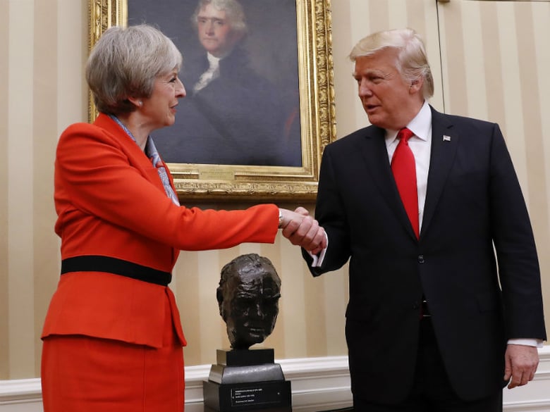 President Donald Trump shakes hands with British Prime Minister Theresa May in the Oval Office of the White House in Washington, Friday, Jan. 27, 2017.