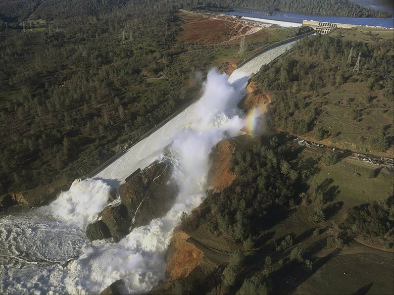 This Saturday, Feb. 11, 2017, aerial photo released by the California Department of Water Resources shows the damaged spillway with eroded hillside in Oroville, Calif. Water will continue to flow over an emergency spillway at the nation's tallest dam