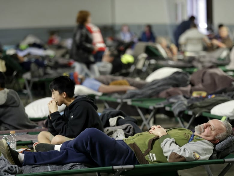 Evacuees rest at a shelter for residents of cities surrounding the Oroville Dam, Monday, Feb. 13, 2017, in Chico, Calif.