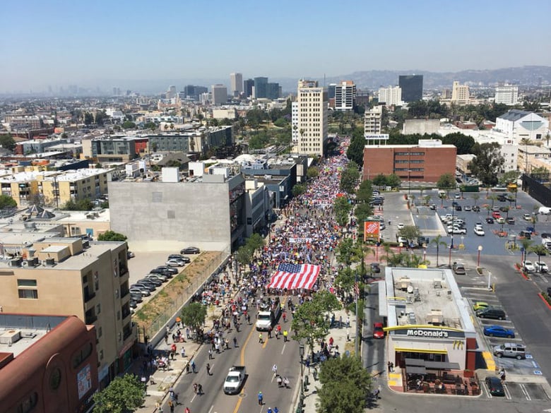 An estimated crowd of 10,000 people march down Wilshire Boulevard in downtown Los Angeles May 1. 