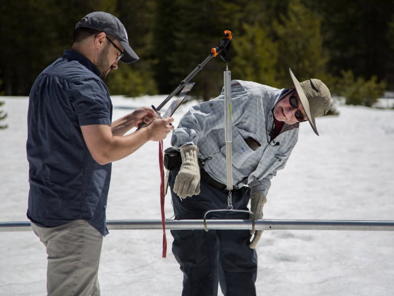 Right, Frank Gehrke chief of the California Cooperative Snow Surveys Program and Wes McCandless a contract analyst, conduct the final snow survey for the 2017 snow season at Phillips Station in the Sierra Nevada Mountains in Northern California.