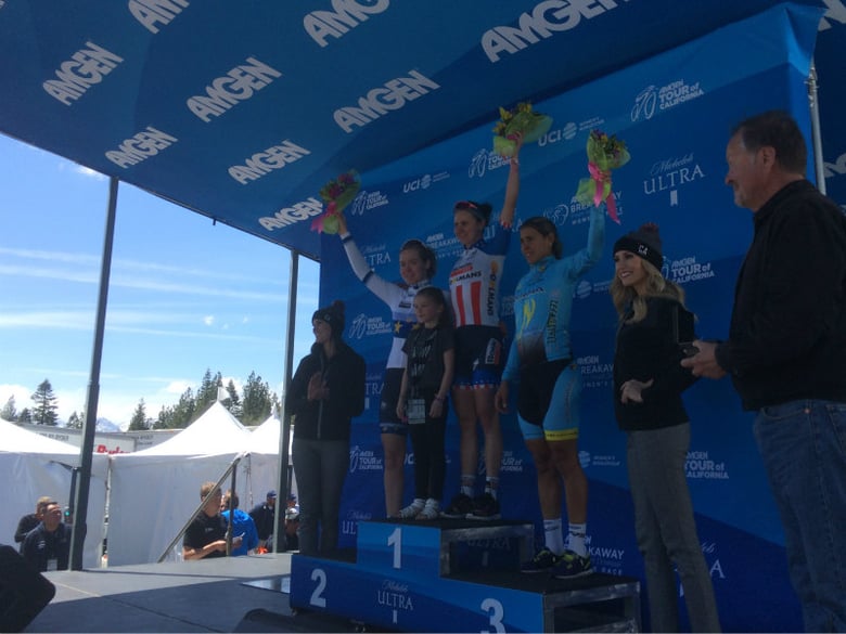 Anna van der Breggen, Megan Guarnier, and Arlenis Sierra wave to the crowd from the podium after stage 1 of the 2017 Amgen Women's Race at South Lake Tahoe.