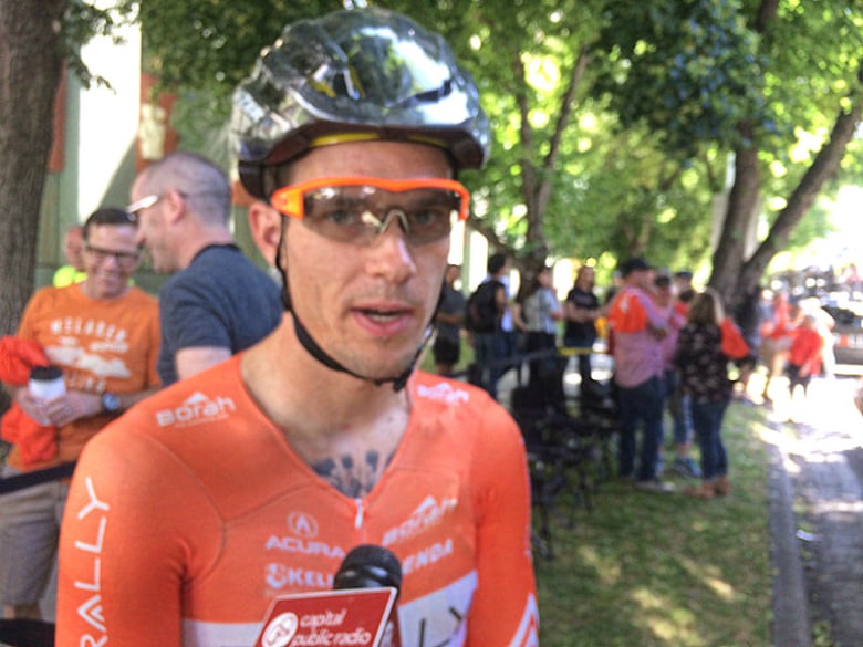 Evan Huffman talks with Capital Public Radio before Amgen stage 1 in Sacramento. The Eldorado Hills member of the Rally racing team. He is the first rider from a Continental team to win an Amgen stage against Pro Continental and World Tour teams.