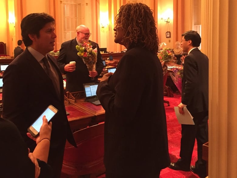 Senate President pro Tem Kevin de León (D-Los Angeles) talks with Senate Budget Committee Chair Holly Mitchell (D-Los Angeles) after the adjournment of session on Thursday, June 8, 2017.