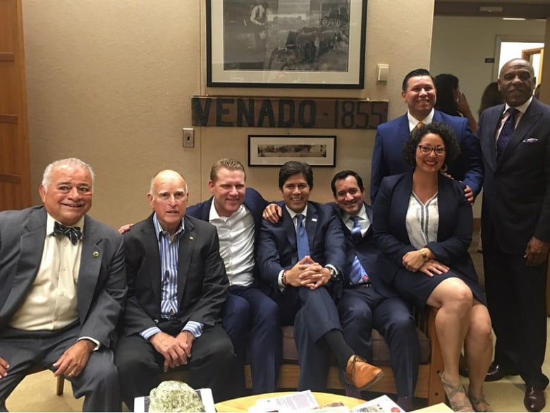 In a photo posted to the Twitter account of Sen. Toni Atkins (D-San Diego), Gov. Jerry Brown poses for a victory photo with Democrats and Republicans after the Legislature voted to extend California's cap-and-trade program on Monday, July 17, 2017.