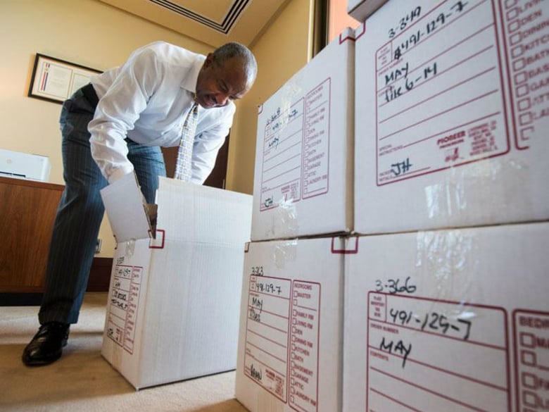 Gary S. May unpacks in Mrak Hall, Monday, July 31, one day before his official first day as chancellor.
