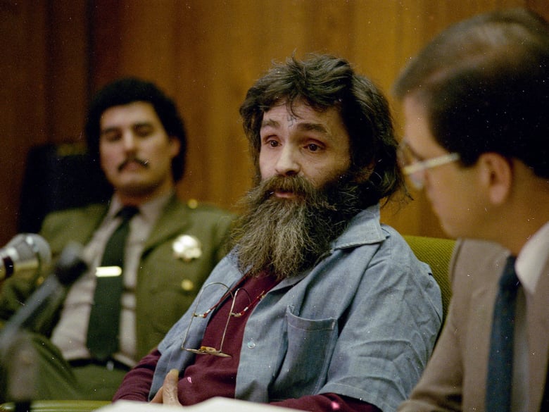 Charles Manson (center), seen during a parole hearing in California in 1986.