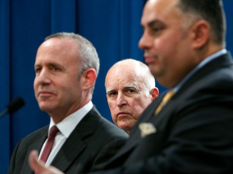 Gov. Jerry Brown (center), with Senate President pro Tem Darrell Steinberg (left) and Assembly Speaker John Pérez (right), announce a budget deal in this June 2013 file photo.