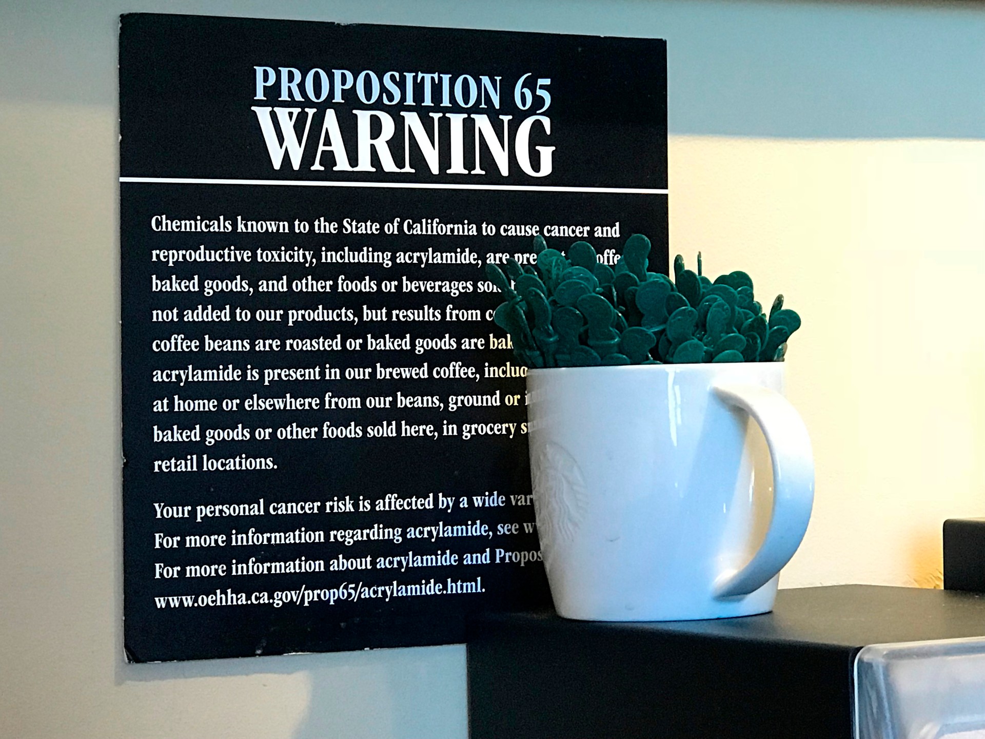 The Messed-Up Reason Starbucks Baristas Are Putting Stickers On Your Cups