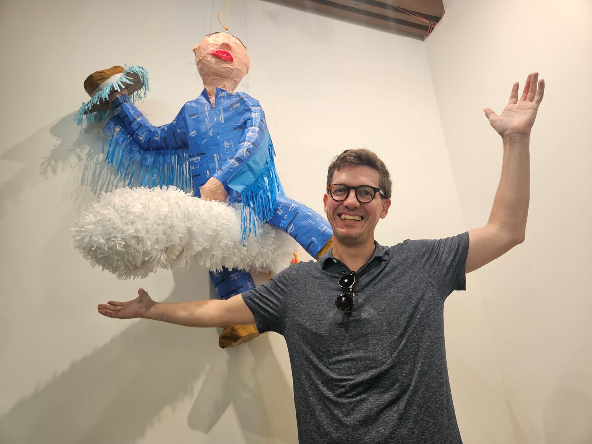 Mat Cusick originally created his pi&ntilde;ata for a picnic between Amazon worker organizers. His design features Amazon founder Jeff Bezos riding a rocket and holding a cowboy hat, mimicking a scene from Dr. Strangelove.