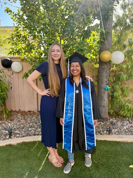 Jaima Mavity (left) attends her student Nancy Palacios&rsquo; (right) graduation in May.