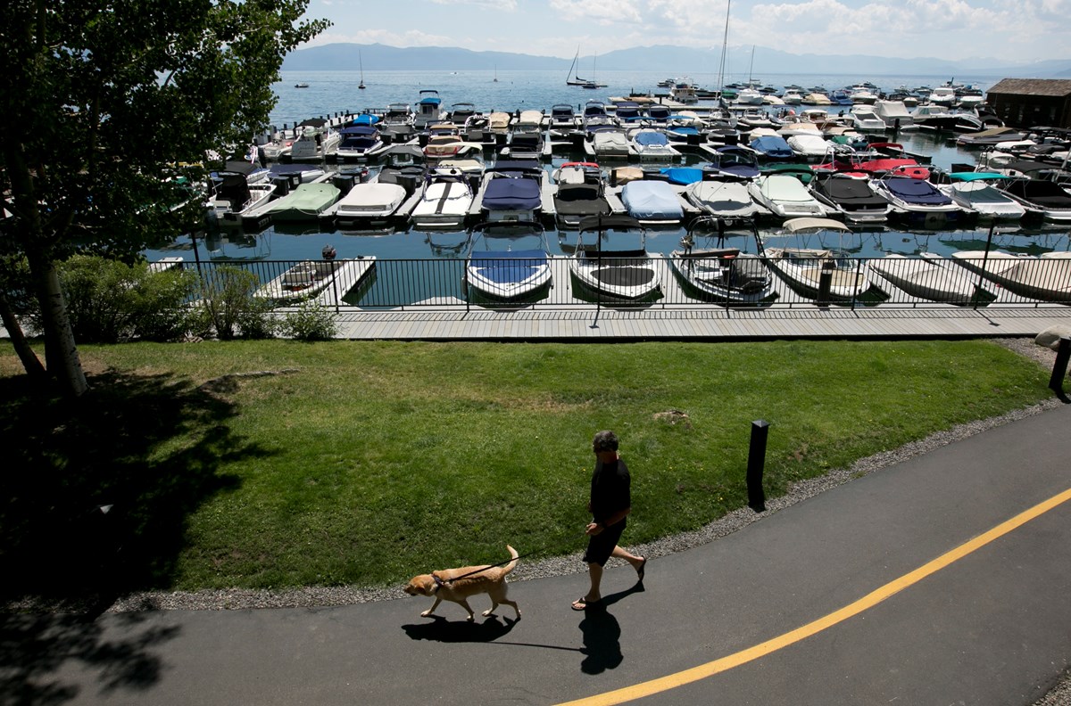 In this photo taken Tuesday, Aug. 8, 2017, boats are moored in a marina on the north shore of Lake Tahoe, in Tahoe City, Calif.