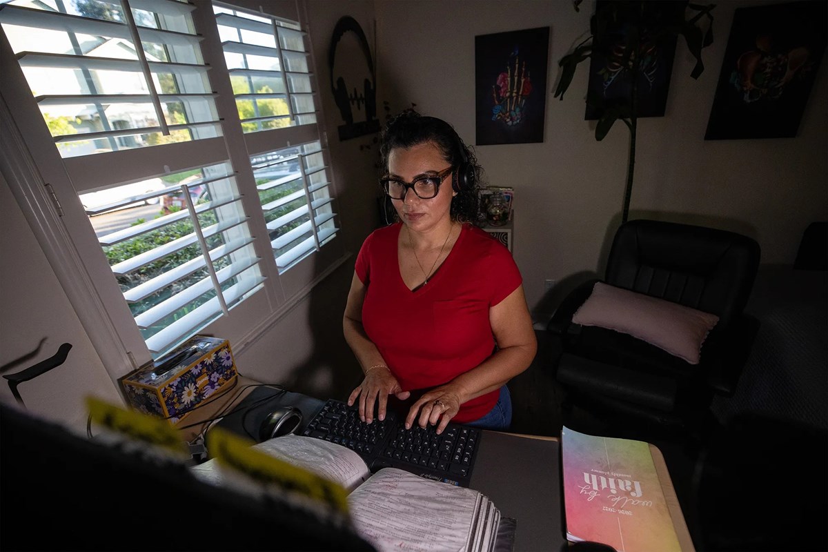 Kaiser Permanente advice nurse Raquel Alvarez Sanchez works from her home office in Santa Rosa on April 6, 2026. Kaiser Permanente nurses have raised concerns about the growing use of AI to monitor their work ahead of upcoming contract negotiations.